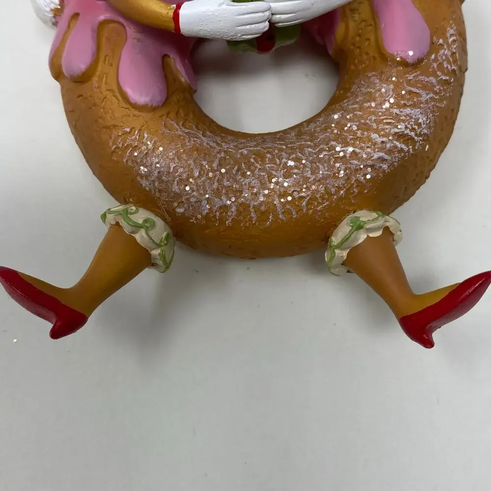 Ornament donut with face and legs